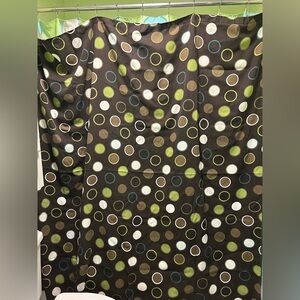 Brown shower curtain with blue and green polka dots